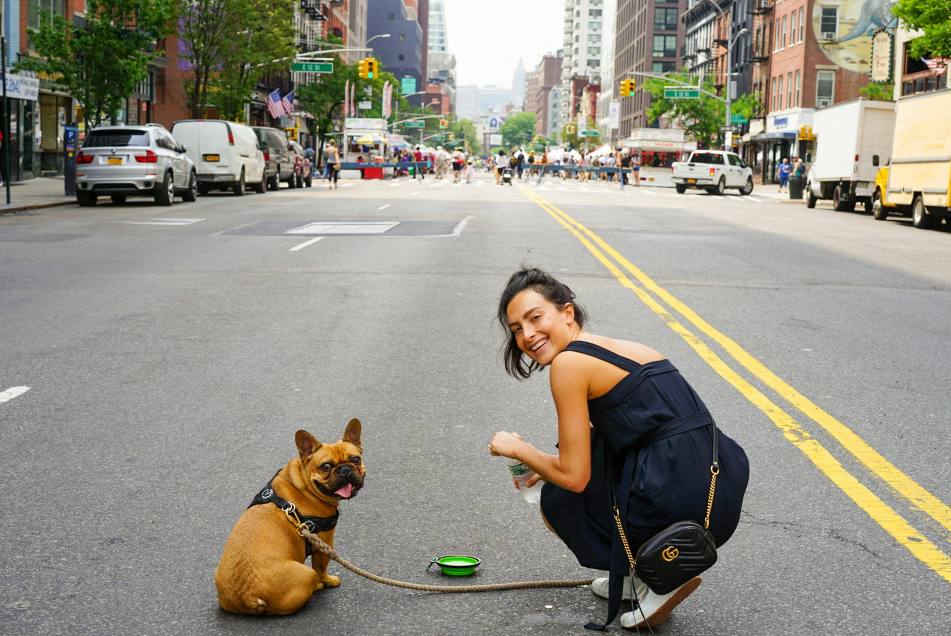 girl with dog on the city street