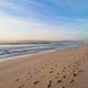 A wide sandy beach in Comporta.