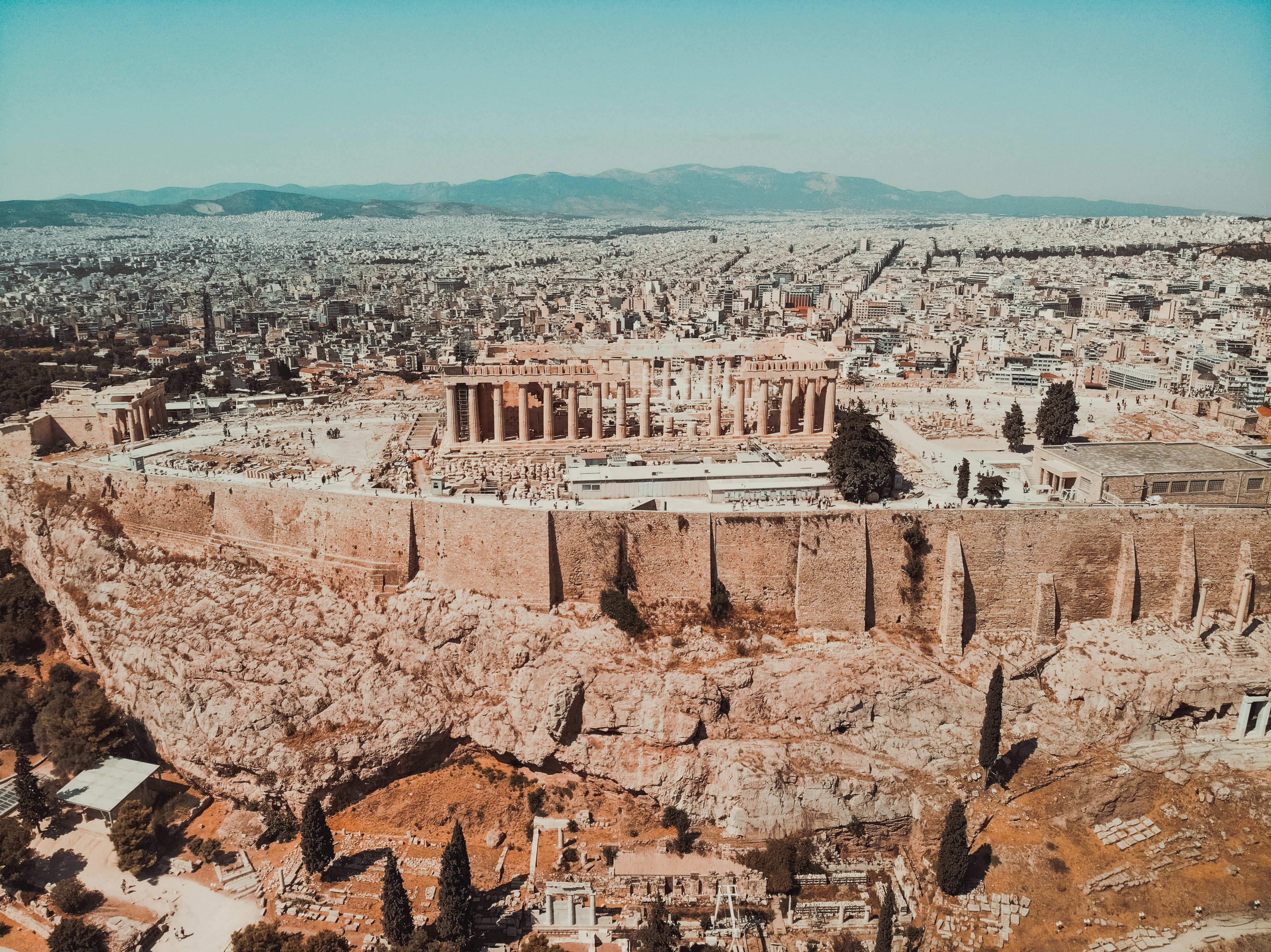 Aerial view of the Acropolis of Athens, showcasing the Parthenon and surrounding cityscape.