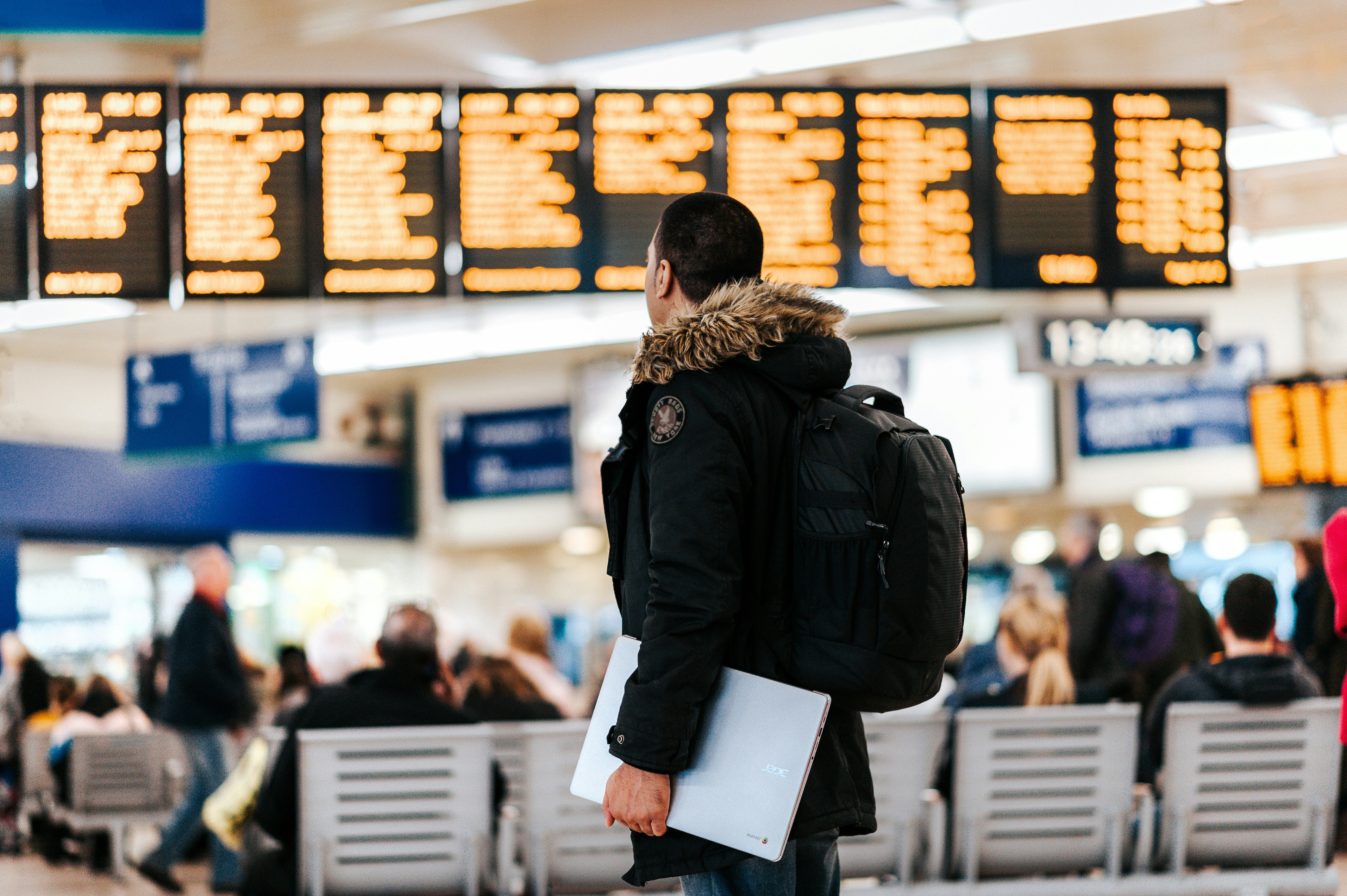 Man is looking at the departure board
