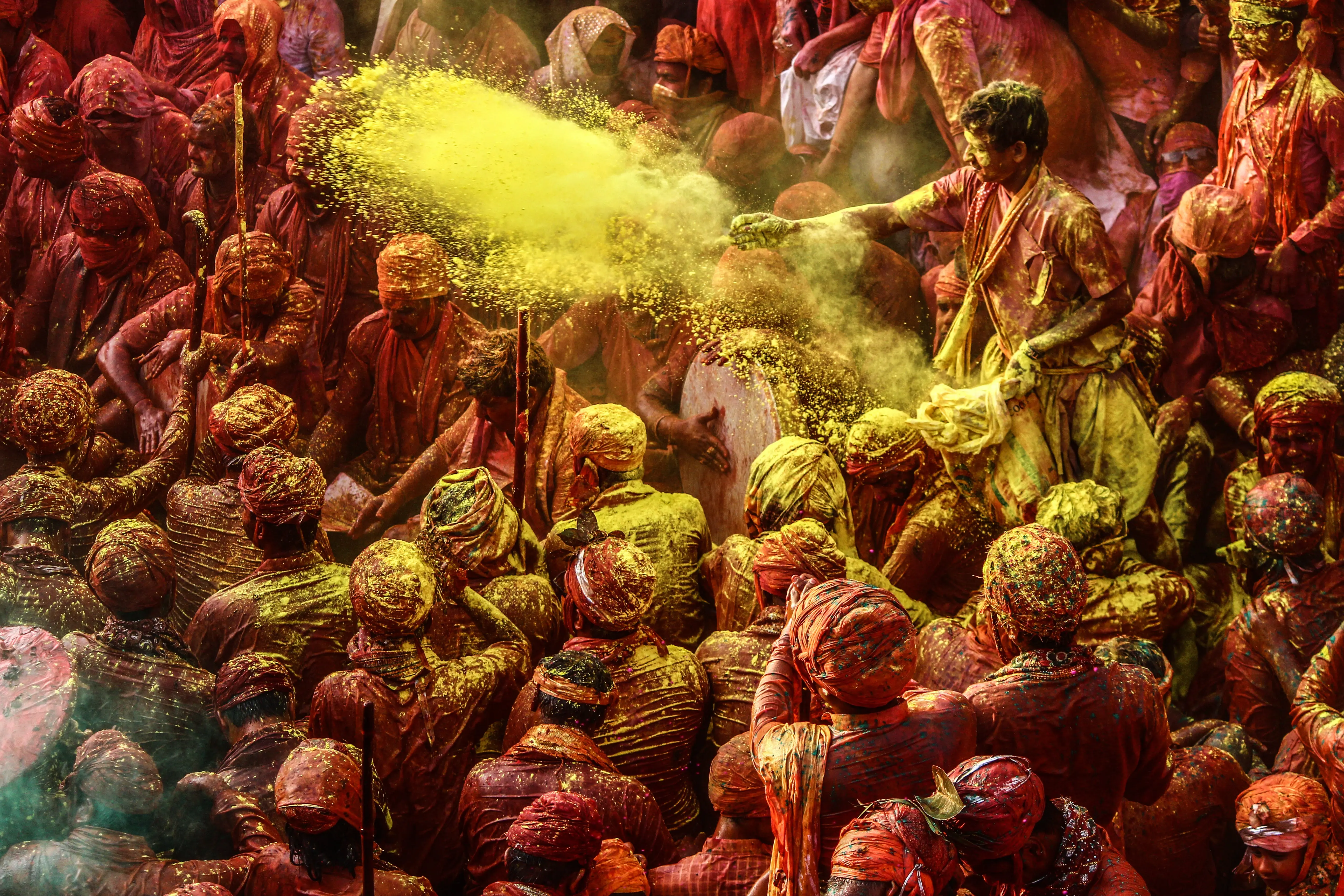 colorful powder being thrown on people
