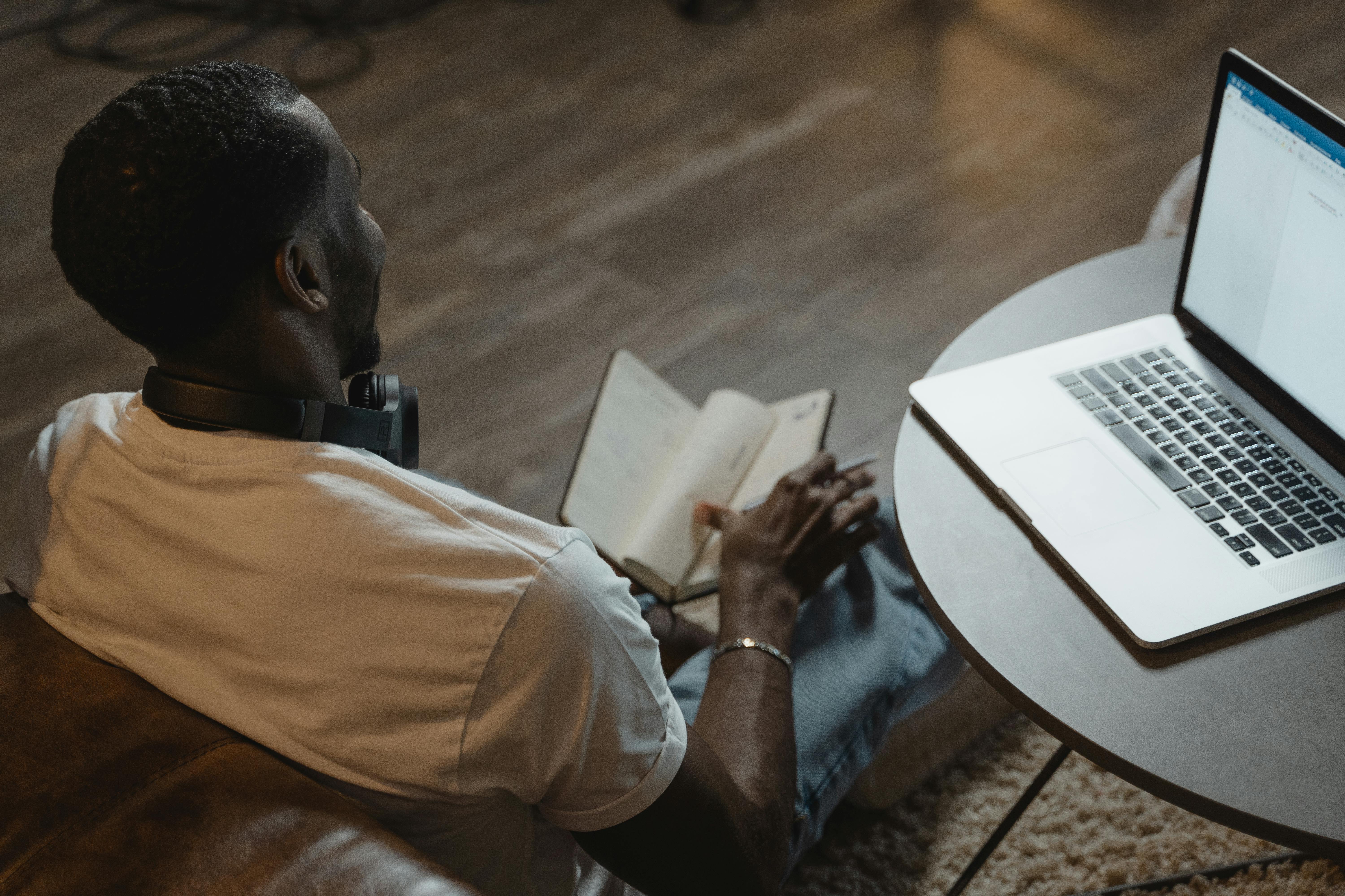 A man is flipping through a notebook