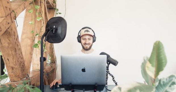 The man is looking at the laptop