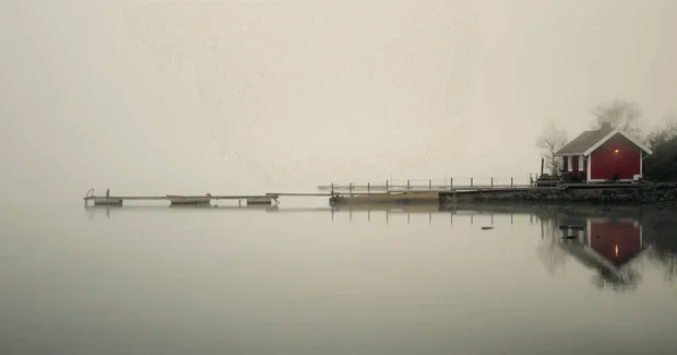 foggy lake with a pier