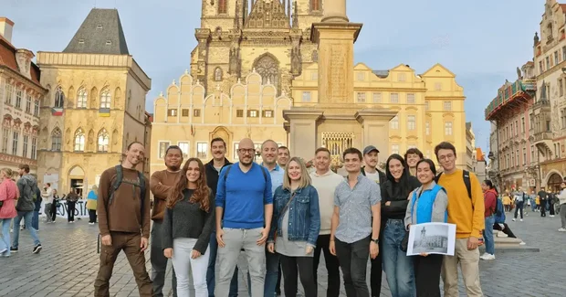 people standing in prague city center