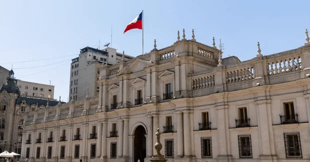 Capital building with flag on it
