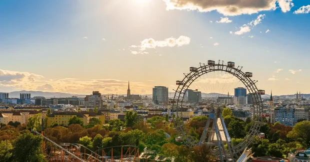 ferris wheel and roller coaster skyline city view