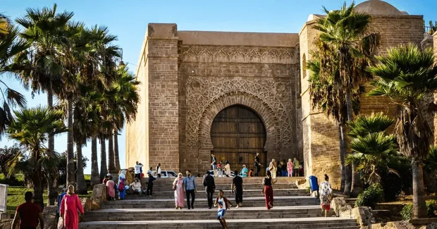 old building with stairs and people