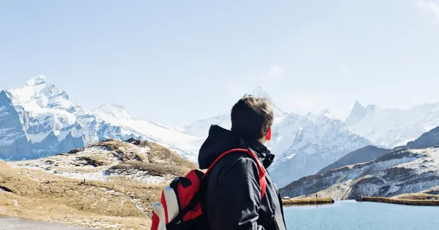 backpacker looking at moutains