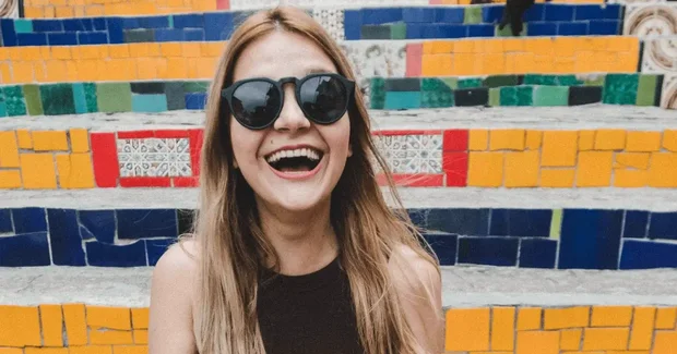 girl laughing with colorful stairs