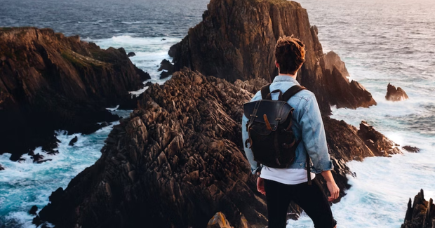 guy overlooking islands from a cliff