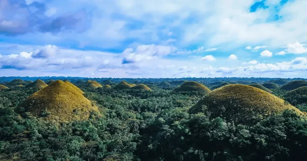 Tall mounds with blue sky