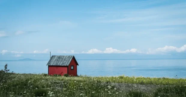 red outhouse on island