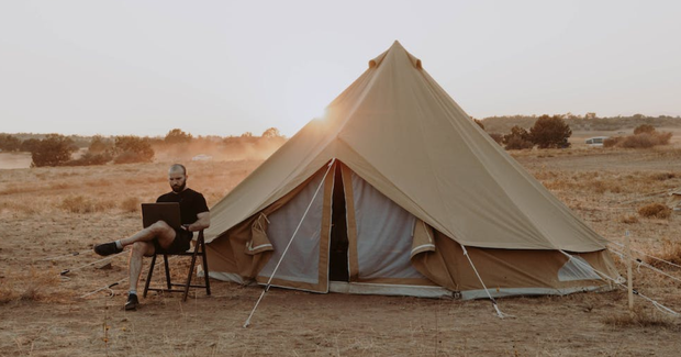 guy working and glamping