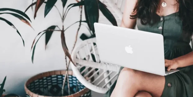 girl working in a chair outside